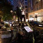 SEATTLE, WA - MAY 30: Protesters riot in the streets following a peaceful rally expressing outrage over the death of George Floyd on May 30, 2020 in Seattle, Washington. Protests have erupted nationwide after Floyd died while in the custody of police in Minneapolis. (Photo by Karen Ducey/Getty Images)