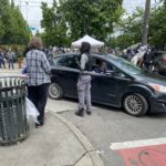 A security volunteer questions a woman as she drives into the only street not blocked off to cars. (Photo: Jason Rantz/KTTH) (Note: Since there's no central leadership, it's unclear if this is individual is working as a volunteer or with a larger group.)
