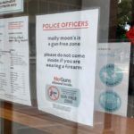 Molly Moon's ice cream in Seattle posts signage with a message for police customers.