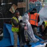 SDOT workers cleaning garbage and tents from the CHOP. (Getty Images)