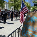 Police separate anti-cop activists from the pro-police crowd. (Photo: Jason Rantz)