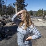 
              Hollie Jordan surveys her father's service station that was destroyed by a wildfire on Tuesday, Sept. 8, 2020, in Malden, Wash. "This was filled with work and life and memories and it's all gone," said Jordan. (AP Photo/Jed Conklin)
            