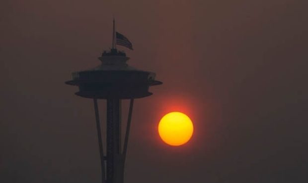 The Space Needle flies an American flag at half-mast in remembrance of the Sept. 11 attacks as the ...
