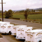 A line of delivery trucks, made by Divco, parked at Smith Brothers Dairy in Kent, circa 1980s. (Smith Brothers Dairy)