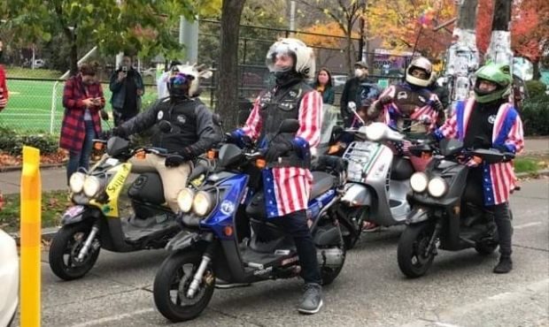 People ride around Capitol Hill with decorated scooters on Saturday. (MyNorthwest reader submitted ...