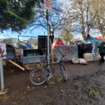 Activists have set up barricades around Cal Anderson Park to keep city staff from helping bring homeless people into shelter. (Photo: listener submitted.)