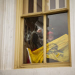 WASHINGTON, DC - JANUARY 06: A member of a pro-Trump mob shatters a window with his fist from inside the Capitol Building after breaking into it on January 6, 2021 in Washington, DC. A pro-Trump mob stormed the Capitol, breaking windows and clashing with police officers. Trump supporters gathered in the nation's capital today to protest the ratification of President-elect Joe Biden's Electoral College victory over President Trump in the 2020 election. (Photo by Jon Cherry/Getty Images)