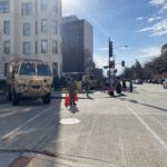 National Guard and other law enforcement stand on patrol. (Photo: Jason Rantz/KTTH)