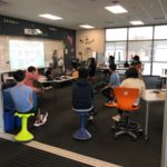 It can be easier to have students separated from each other when working with light, flexible stools, as opposed to large, heavy desks and chairs. 