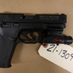 Recovered Smith & Wesson .22 caliber pistol with laser sight.