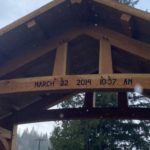 The wooden arch with the date of the Oso landslide is the newest piece of the memorial. (Hanna Scott, KIRO Radio)