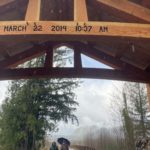 The wooden arch with the date of the Oso landslide. (Hanna Scott, KIRO Radio)