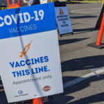 A sign outside a West Seattle vaccine site. (MyNorthwest photo)