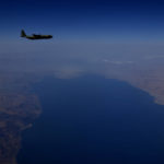 
              A C130 transport aircraft flies over the Dead Sea border between Israel and Jordan on its way to drop paratroopers as part of a joint British-Jordanian airdrop exercise on Wednesday, June 23, 2021. Britain's armed forces minister says British paratroopers have trained together with Jordanian soldiers in an airdrop over the Middle Eastern country to underscore the U.K.'s support for Jordan and commitment to regional stability. (AP Photo/Petros Karadjias)
            