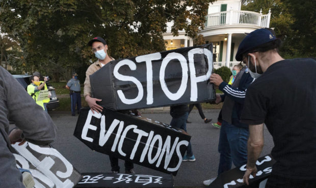 FILE - In this Oct. 14, 2020, file photo, housing activists erect a sign in Swampscott, Mass. A fed...