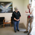 
              In this June 30, 2021, photo Sen. Chuck Grassley, R-Iowa, talks with General Manager Dana Ingerslev, left, before a meeting with employees at Professional Computer Solutions in Denison, Iowa. (AP Photo/Charlie Neibergall)
            