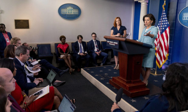 Commerce Secretary Gina Raimondo, accompanied by White House press secretary Jen Psaki, second from...