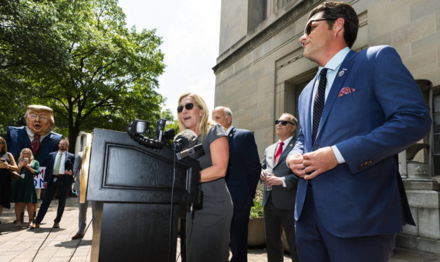 Rep. Marjorie Taylor Greene, R-Ga., left, together with Rep. Matt Gaetz, R-Fla.,right, and Rep. Lou...