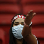 
              A Brazil Flamengo fan cheers before the start of a Copa Libertadores round of 16 second leg soccer match between Brazil's Flamengo and Argentina's Defensa y Justicia, the first game with fans amid the COVID-19 pandemic at the National Stadium in Brasilia, Brazil, Wednesday, July 21, 2021. (Adriano Machado/Pool via AP)
            