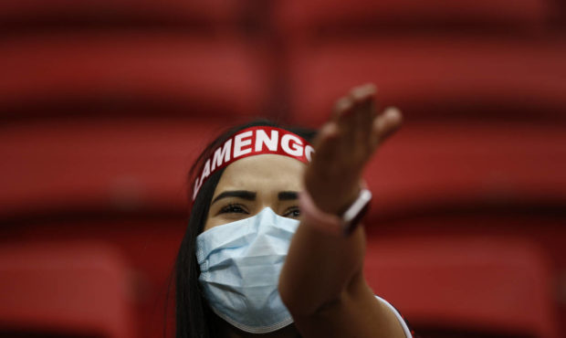 A Brazil Flamengo fan cheers before the start of a Copa Libertadores round of 16 second leg soccer ...