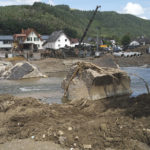 
              German Armed Forces begin to erect a temporary bridge over the river Ahr at Insul, Germany, Monday July 26, 2021, after devastating floods.  Recent heavy rains caused deadly floods across the region, with some thousands of people displaced as towns and villages were inundated. (Thomas Frey/dpa via AP)
            