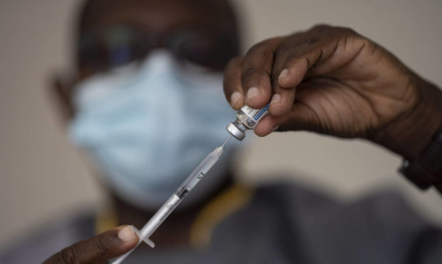 FILE—In this Wednesday, July 28, 2021 file photo, a health worker administers a dose of Janssen C...