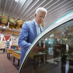 
              President Joe Biden look at pies in a case at the King Orchards fruit farm Saturday, July 3, 2021, in Central Lake, Mich. (AP Photo/Alex Brandon)
            
