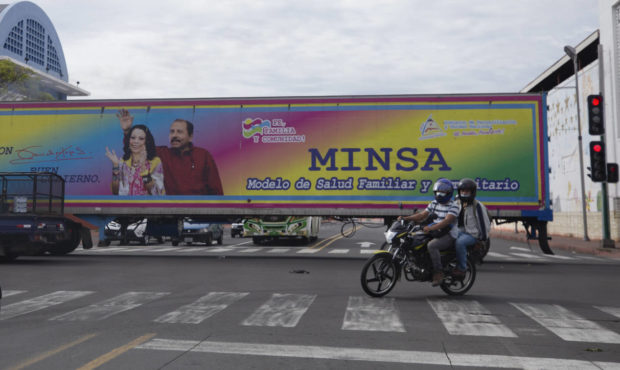 FILE - In this June 17, 2021 file photo, a billboard promoting President Daniel Ortega and his wife...