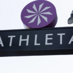 
              File-This Sept. 20, 2018, file photo shows the Athleta clothing logo is seen at a store in Pasadena, Calif. Simone Biles’ sponsors including Athleta and Visa are lauding her decision to put her mental health first and withdraw from the gymnastics team competition during the Olympics. It’s the latest example of sponsors praising athletes who are increasingly open about mental health issues. (AP Photo/Damian Dovarganes, File)
            