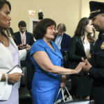 
              Rep. Ann McLane Kuster, D-N.H., center,  and Rep. Veronica Escobar, D-Texas, talk to U.S. Capitol Police Sgt. Aquilino Gonell after he testified  before the House select committee hearing on the Jan. 6 attack on Capitol Hill in Washington, Tuesday, July 27, 2021. (Chip Somodevilla/Pool via AP)
            