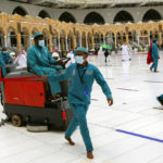 
              Workers disinfect the grounds at the Grand Mosque to help protect against the coronavirus in the Muslim holy city of Mecca, Saudi Arabia, Thursday, July 22, 2021. The virus has taken its toll on the annual hajj for a second year running. What once drew some 2.5 million Muslims from all walks of life from across the globe, the hajj pilgrimage is now almost unrecognizable in scale. (AP Photo/Amr Nabil)
            