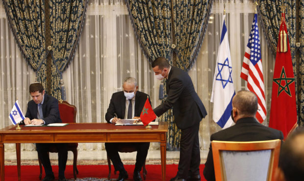 FILE - In this Dec. 22, 2020 file photo, Morocco and Israel sign agreements on direct flights, fina...