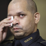 
              U.S. Capitol Police Sgt. Aquilino Gonell wipes his eye as he watches a video being displayed during a House select committee hearing on the Jan. 6 attack on Capitol Hill in Washington, Tuesday, July 27, 2021. (Jim Lo Scalzo/Pool via AP)
            
