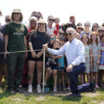 
              President Joe Biden poses for a photo after touring King Orchards fruit farm Saturday, July 3, 2021, in Central Lake, Mich. (AP Photo/Alex Brandon)
            