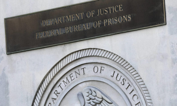 FILE - In this July 6, 2020, file photo a sign for the Department of Justice Federal Bureau of Pris...