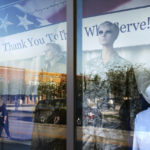 
              Mannequins stand in a window paying tribute to military and public service members along a downtown street in Palatka, Fla., Tuesday, April 13, 2021. (AP Photo/David Goldman)
            