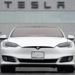 
              FILE - This Sunday, May 9, 2021 file photo shows vehicles at a Tesla location in Littleton, Colo. Tesla delivered 201,250 vehicles in the second quarter, an improvement over first-quarter figures but below the expectations of Wall Street analysts. Tesla and other automakers have been hampered by a global shortage of computer chips. (AP Photo/David Zalubowski)
            