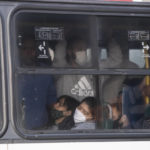 
              Commuters crowd a bus during the COVID-19 pandemic in Rio de Janeiro, Brazil, Friday, July 23, 2021. (AP Photo/Bruna Prado)
            