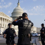 
              The U.S. Capitol is seen in Washington, early Tuesday, July 27, 2021, as U.S. Capitol Police watch the perimeter. Democrats are launching their investigation into the Jan. 6 Capitol insurrection. They're beginning with a focus on the law enforcement officers who were attacked and beaten as the rioters broke into the building. It's an effort to put a human face on the violence of the day. The police officers who are testifying Tuesday endured some of the worst of the brutality. The panel's first hearing comes as partisan tensions have only worsened since the insurrection. Many Republicans have played down or outright denied the violence that occurred and denounced the Democratic-led investigation as politically motivated. (AP Photo/J. Scott Applewhite)
            