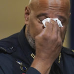 
              CORRECTS IDENTIFICATION FROM HODGES TO DUNN - U.S. Capitol Police Sgt. Harry Dunn wipes his eyes during the House select committee hearing on the Jan. 6 attack on Capitol Hill in Washington, Tuesday, July 27, 2021. (AP Photo/ Andrew Harnik, Pool)
            