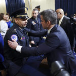 
              Rep. Adam Kinzinger, R-Ill., hugs U.S. Capitol Police Sgt. Aquilino Gonell after a House select committee hearing on the Jan. 6 attack on Capitol Hill in Washington, Tuesday, July 27, 2021. (Jim Lo Scalzo/Pool via AP)
            