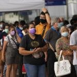 
              Residents wait on line to receive shots of the AstraZeneca COVID-19 vaccine at the Central Vaccination Center in Bangkok, Thailand, Thursday, July 22, 2021. (AP Photo/Sakchai Lalit)
            