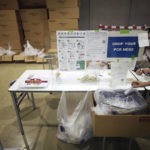 
              A woman drops off a test for the coronavirus infection at the Main Press Center for the 2020 Summer Olympics, Thursday, July 29, 2021, in Tokyo, Japan. About 30,000 people are spitting into tiny plastic vials every day at the Tokyo Olympics in a routine that’s grown crucial in going ahead with the pandemic-era Games. (AP Photo/Hiro Komae)
            