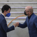 
              Japan's Environment Minister Shinjirō Koizumi is welcomed by Italian Minister for Ecological Transition Roberto Cingolani as he arrives at Palazzo Reale in Naples, Italy, Thursday, July 22, 2021, to take part in a G20 meeting on environment, climate and energy. (AP Photo/Salvatore Laporta)
            