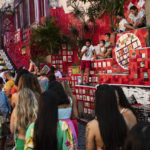 
              People line up to take their pictures on the Selaron Stairway in Rio de Janeiro, Brazil, Friday, July 23, 2021, during the COVID-19 pandemic. (AP Photo/Bruna Prado)
            