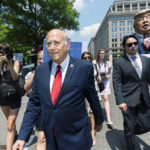 
              Rep. Louie Gohmert, R-Texas, together with other Republican lawmakers and their supporters, hurriedly leave a rally in front of the Department of Justice building in Washington, Tuesday, July 27, 2021 as counter-protesters disrupted their rally. The Republican lawmakers were demanding the release of the Jan 6 "prisoners." (AP Photo/Manuel Balce Ceneta)
            