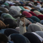 
              Palestinian Muslims attend the prayer of the first day of Eid al-Adha in Gaza City, Tuesday, July. 20, 2021. (AP Photo/Khalil Hamra)
            