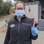 
              In this Thursday, July 1, 2021, photo released by the Oakland Zoo Veterinary Technician, Monica Fox poses for a picture after administering a COVID-19 vaccine at the Oakland Zoo in Oakland, Calif. The Oakland Zoo zoo is vaccinating its large cats, bears and ferrets against the coronavirus using an experimental vaccine being donated to zoos, sanctuaries and conservatories across the country. (Oakland Zoo via AP)
            