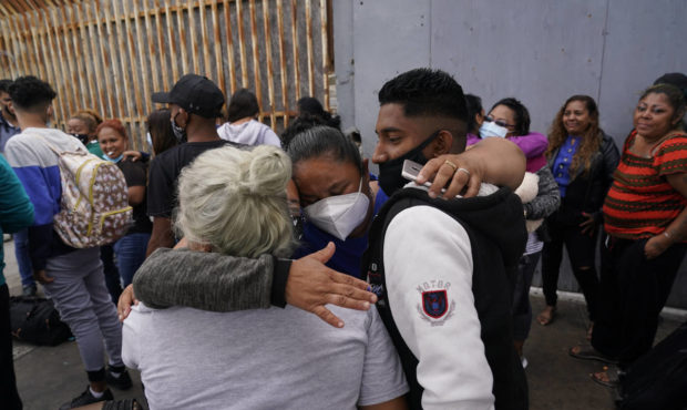 FILE - In this July 5, 2021, file photo, Alex Cortillo, right, of Honduras gets a hug from Erika Va...