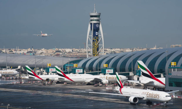 FILE - In this Dec. 11, 2019, file photo, an Emirates jetliner comes in for landing at the Dubai In...